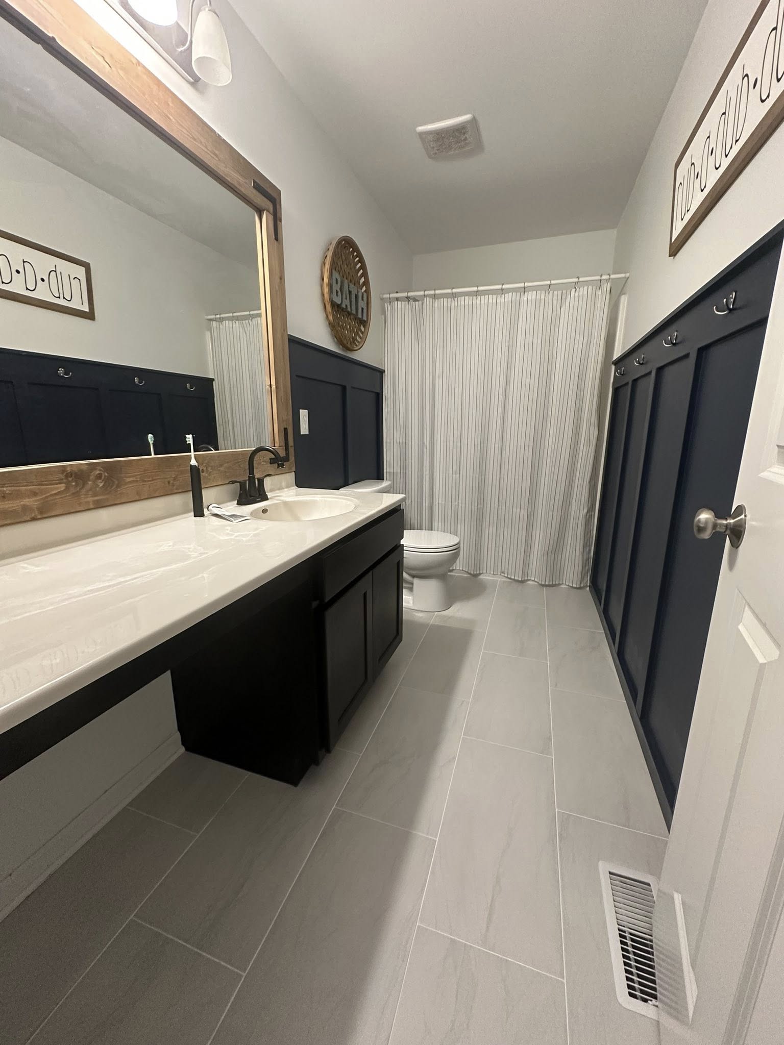 Farmhouse bathroom remodel dark vanity NWI